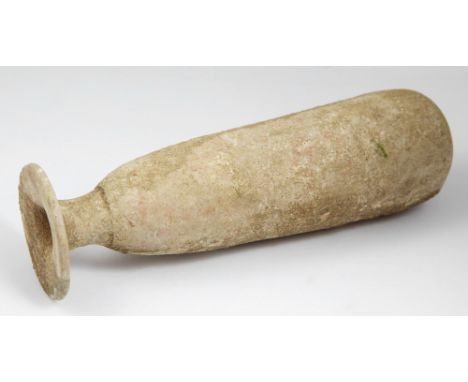An oriental Greek alabastron4th – 3rd century BC; lungh. cm 18,5; Alabastron in light coloured clay with a disc-shaped rim, s
