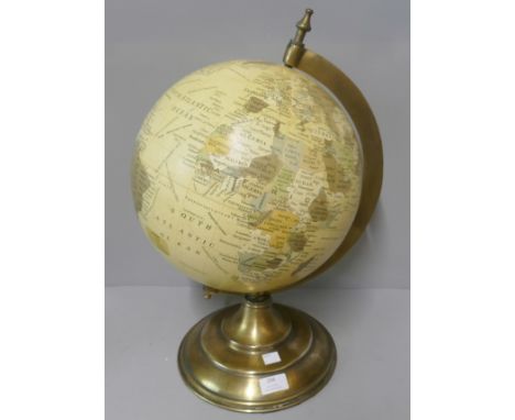 A desk top terrestrial globe on brass stand 