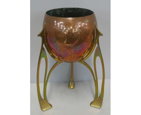 An Art Nouveau Jugendstil copper and brass planter, c1910, of rocket form with pierced open 