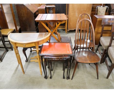 A pair of Ercol chairs, folding occasional table, beech demi-lune hall table, a mahogany coffee table and a nest of tables 