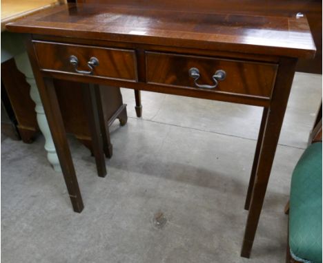 A mahogany two drawer console table 