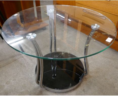 A circular glass and chrome coffee table 