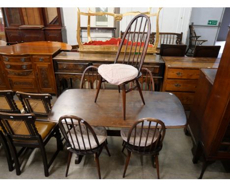 An Ercol  Golden Dawn elm refectory table and five chairs 