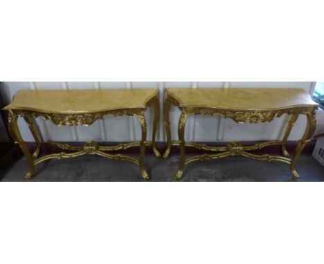 A pair of Louis XV style giltwood console tables 