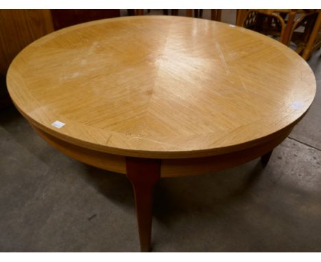 A Stonehill teak circular sunburst coffee table 