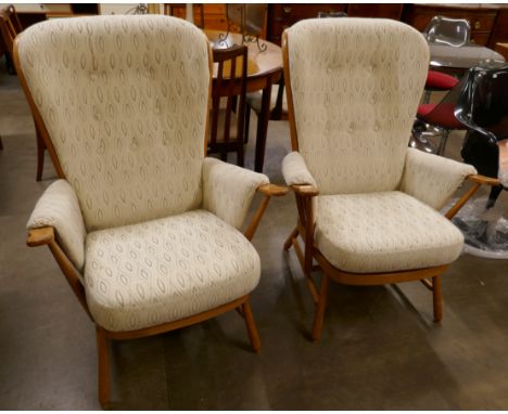 A pair of Ercol Blonde beech Evergreen armchairs. Purchased by the vendor from Hopewells, Nottingham 2017 for £2,340 