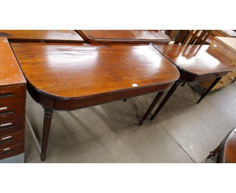 A pair of Regency mahogany console tables 