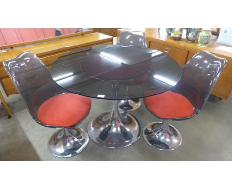 A French Agier Cuivre circular glass and chrome tulip dining table and three chairs 