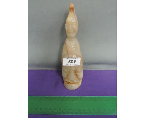 A jade/hardstone figure modelled as head on head