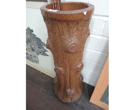 A 19th century salt glazed stoneware stickstand/base of naturalistic log tree trunk form