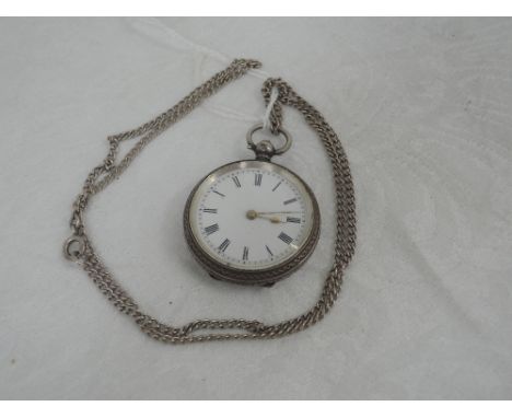 A continental silver key wound pocket watch having Roman numeral dial to white enamel face in an extensively engraved case st
