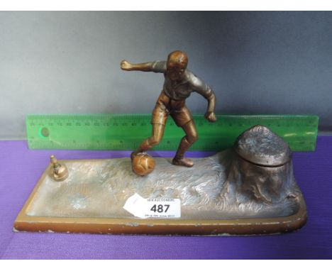 An Austrian spelter inkwell modelled as vintage footballer