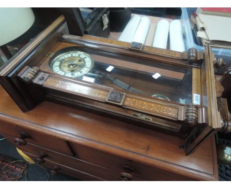 An early 20th century walnut Vienna wall clock having pokerwork and spindle decoration 