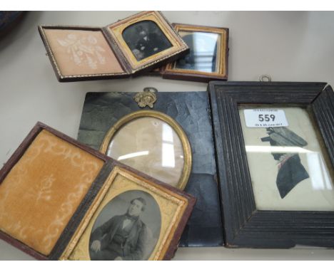 A 19th century silhouette watercolour in frame, a late Victorian oval photograph portrait study, and three daguerreotype port