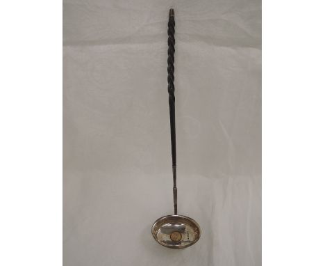 A Georgian silver toddy ladle having coin insert dated 1787 and a whalebone twist handle, London 1807, Josiah Snatt