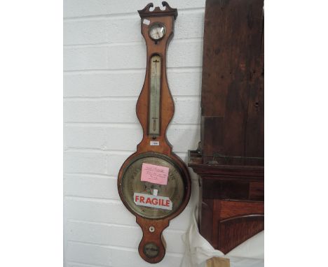 A 19th century mahogany frame wheel barometer having humidity, thermometer and level scales, J Sillo