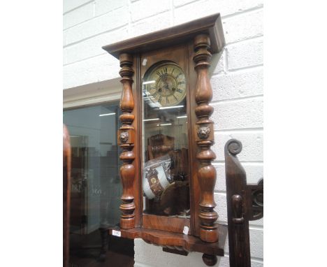 An early 20th century mahogany Vienna wall clock of traditional design having crest, pillar and panel