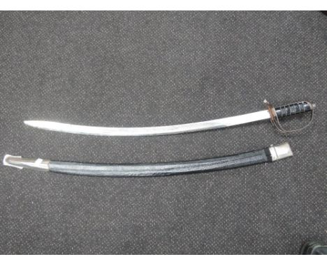 A 19th century Indian sword in scabbard 