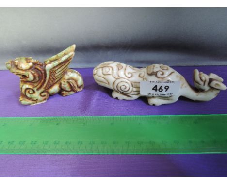 A jade figure modelled as Pixou with wings and a jade/hardstone modelled as a lion and dragon