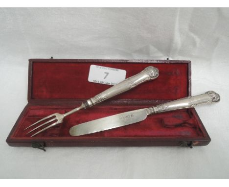 A cased Georgian silver handled child's knife and fork having moulded handles with scallop decoration, Sheffield 1831, Aaron 