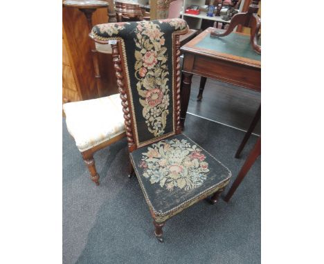 A Victorian mahogany frame Prie Dieu prayer chair having twist frame and tapestry upholstery