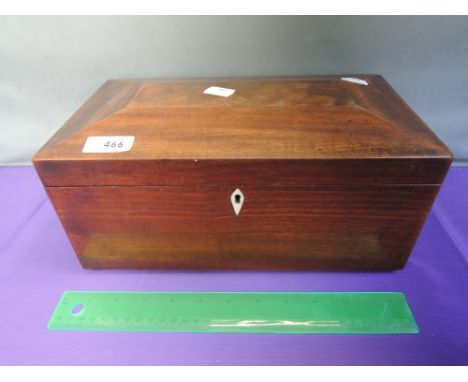 A Victorian mahogany tea caddy having chamfered lid