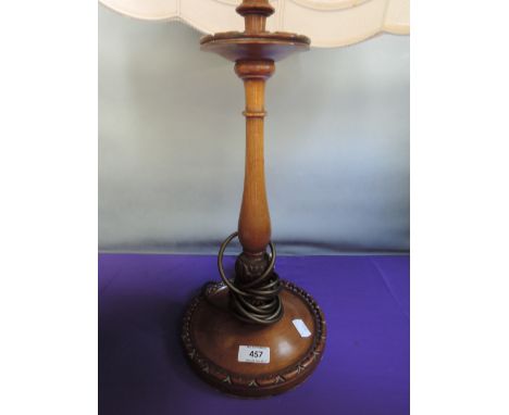 An early/mid 20th century mahogany table lamp having turned column with later shade