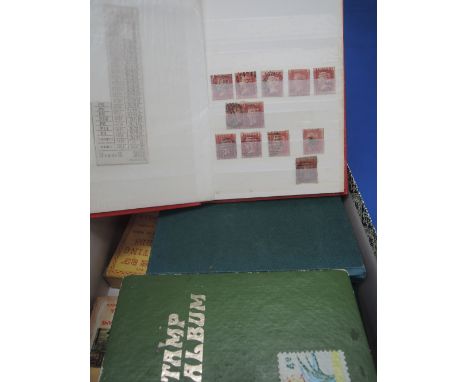 A box containing four stamp albums including good penny reds and good U.S.A., two packs of playing cards and a cash book 1906