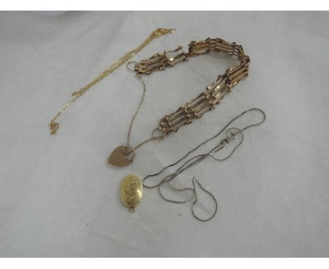 Three pieces of broken yellow metal jewellery including a 9ct gold gate bracelet, 9ct gold chain and locket stamped 585,  app