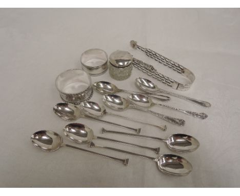 A selection of HM silver including napkin rings, button hook, sugar nips and teaspoons