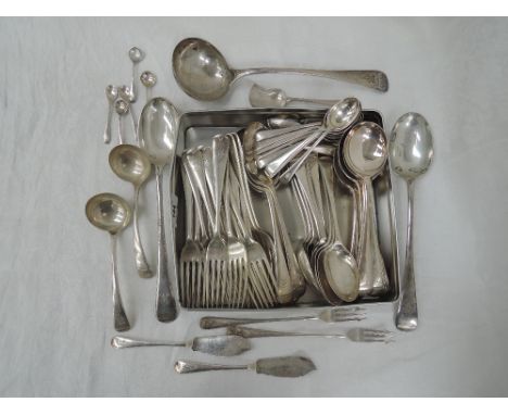 A part set of silver cutlery (85 pieces) of plain form having JTG monogram to terminals, including ladle, basting spoons, etc