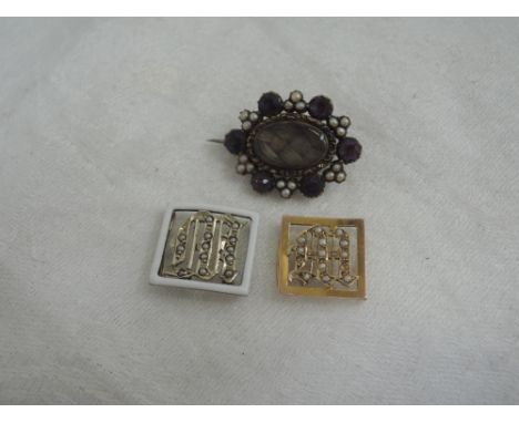 Three pieces of vintage yellow metal jewellery including a mourning brooch having plaited hair panel with seed pearl and amet