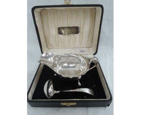 A cased silver sauce boat and ladle with presentation plaque to ' Lt Col D B Long M C T D by the Warrant Officers and Sergean