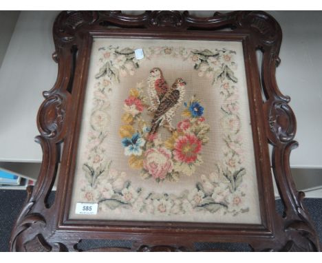 A Victorian mahogany frame Berlin woolwork tapestry having bird and foliage decoration