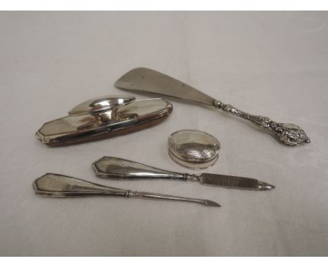 Three HM silver handled manicure items including nail buffer, a small silver patch box and an HM silver handled shoe horn