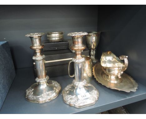 A selection of silver plated ware including cased flatware,  telescopic candlesticks, sauce boat and saucer, tankard etc