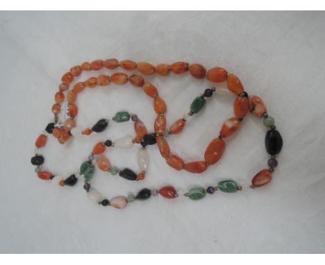 A string of roughcut carnelian beads and a string of various mineral beads including agate, carnelian and amethyst