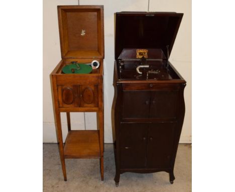 An HMV Model 180 Cabinet Gramophone, with record storage racks behind twin doors, below re-entrant horn doors above, lacking 