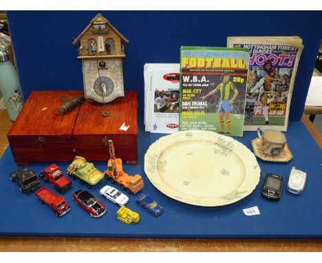 A quantity of 'Talking Bull' and 'Shoot' magazines, 'Toggili' cuckoo clock and small quantity of Corgi and Matchbox vehicles 