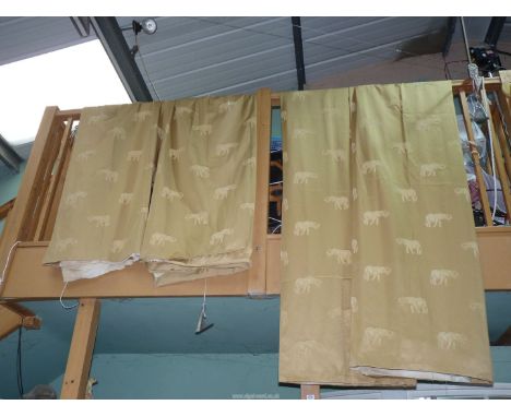 A pair of curtains in gold coloured fabric with Elephant design, 83 1/2'' drop x 54'' wide  plus another unfinished pair in g