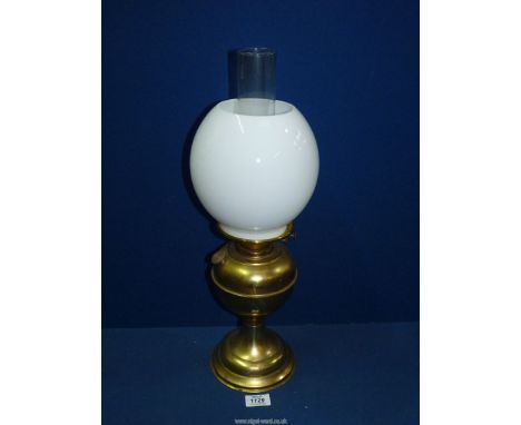 A brass Oil lamp (working) with milk glass globe shade, 19 1/2" tall.