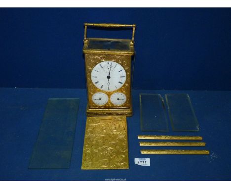 An impressive quality gilt/brass cased mantel clock for restoration having a three-train spring- driven movement, the balance