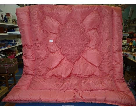 A single pink Eiderdown with ruched and emboidered pattern ,some marks.