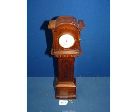 A miniature Grandfather clock by Bryson, Edinburgh, with key, 15" tall.