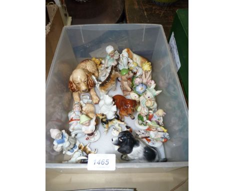 A box of miscellaneous china ornaments including; Sylvac dog and puppy, Beswick hound, figures of children playing, etc. Some