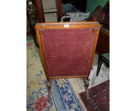 An unusual Oak framed Firescreen having splay feet and unusually with pull-out wings and raising section to the top, 25'' wid