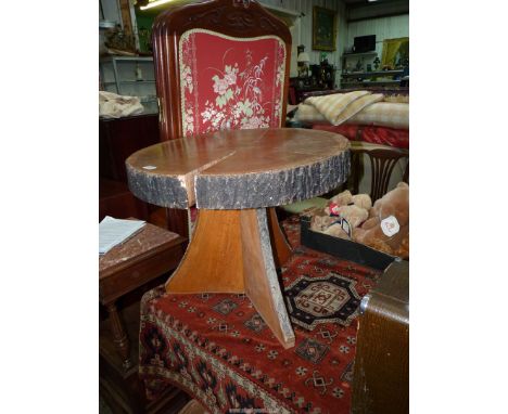 A rustic Oak tree trunk slice topped Occasional Table standing on a triple tree slice base, 27'' diameter x 21 1/2'' high app