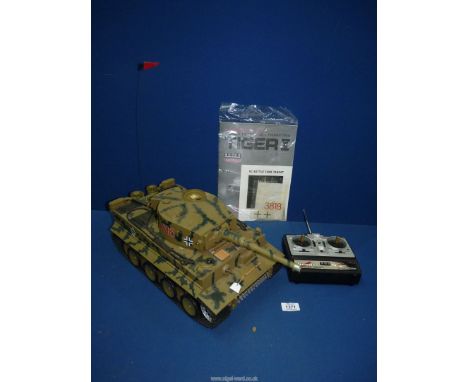 A radio controlled model of a German Tiger I Tank, complete with instruction manual, gun target, carrying cradle and slings a