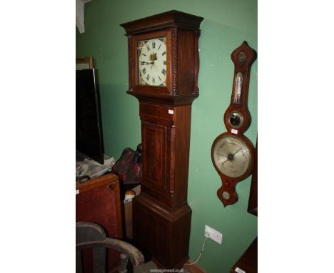 An Oak and Mahogany cased longcase / grandfather clock having light and dark-wood stringing, the painted face with Roman nume