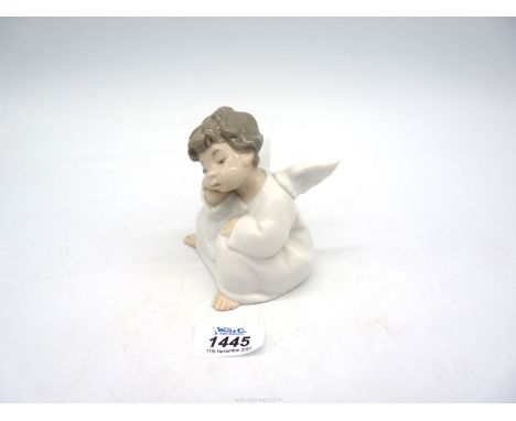 A Lladro figure of Cherub sleeping.